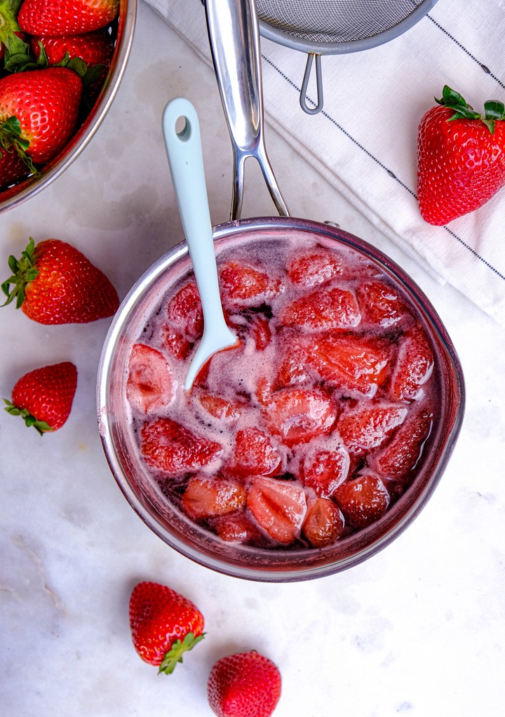 Strawberries simmering in a saucepan. 