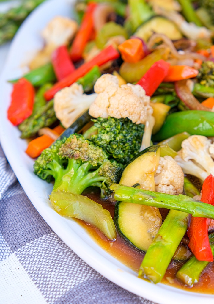 Cooked vegetable stir fry on a serving plate ready to eat.
