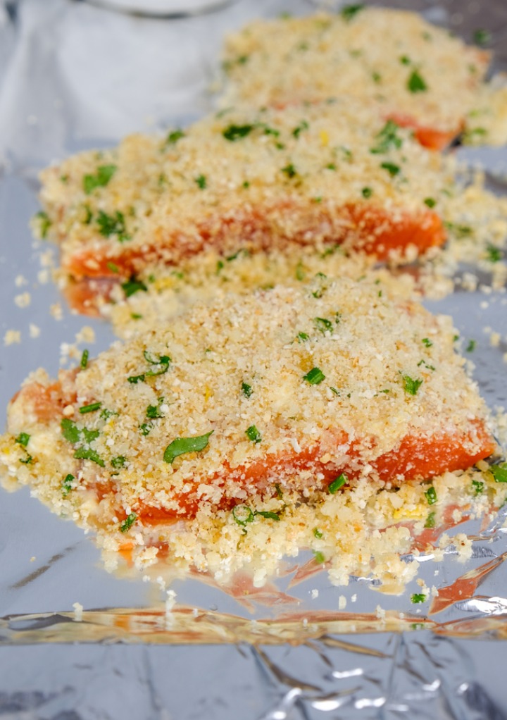 Breading mix on top of salmon slices before cooking. 