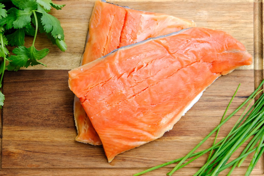 Fresh salmon on a cutting board. 