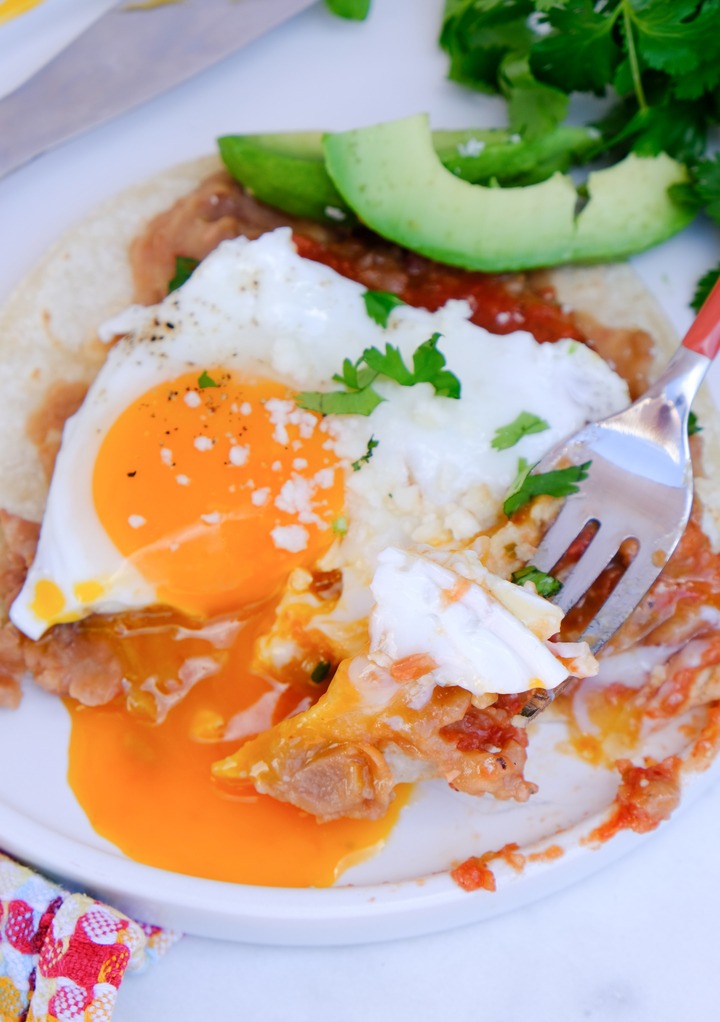 Mexican breakfast with egg, beans and ranchero sauce. 