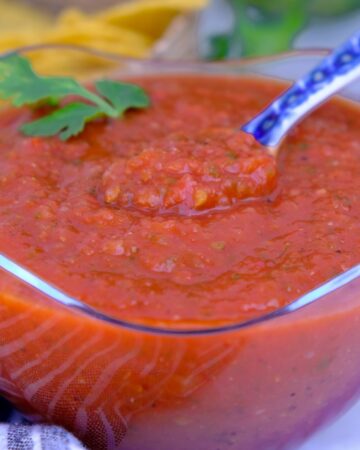 Homemade ranchero sauce in a clear bowl.