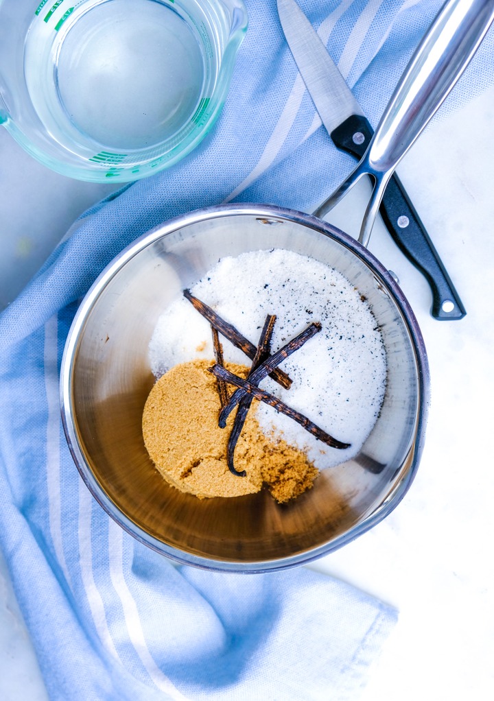 Ingredients to make vanilla syrup in a saucepan. 