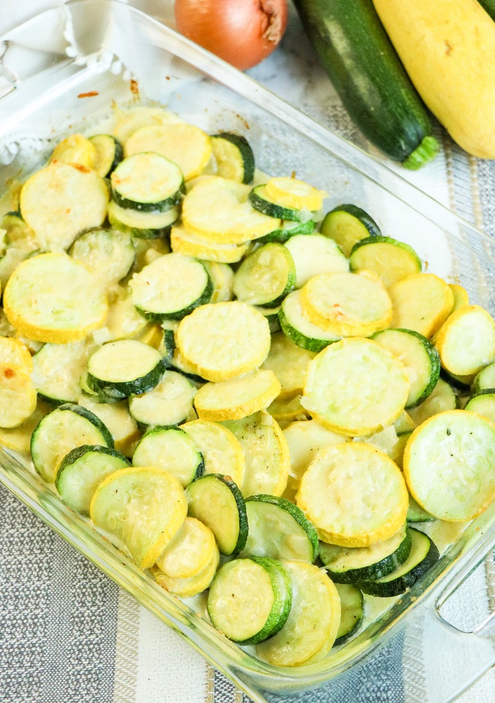 Sliced zucchini in a clear baking dish ready to be served. 