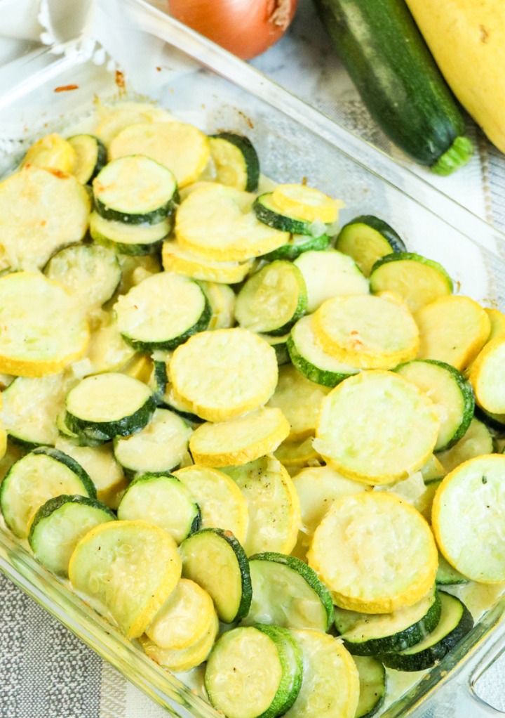 Roasted zucchini in a glass casserole dish.