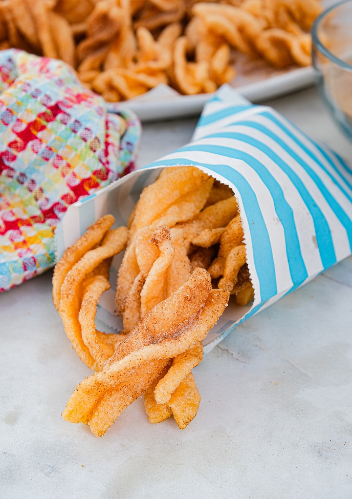 Taco Bell cinnamon twists in a blue and white snack bag ready to eat. 