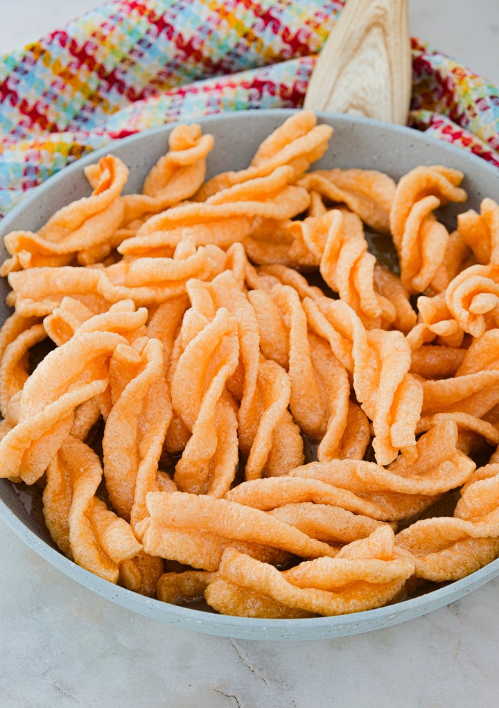 Fried wheat twists to make cinnamon twists before adding sugar cinnamon mix. 