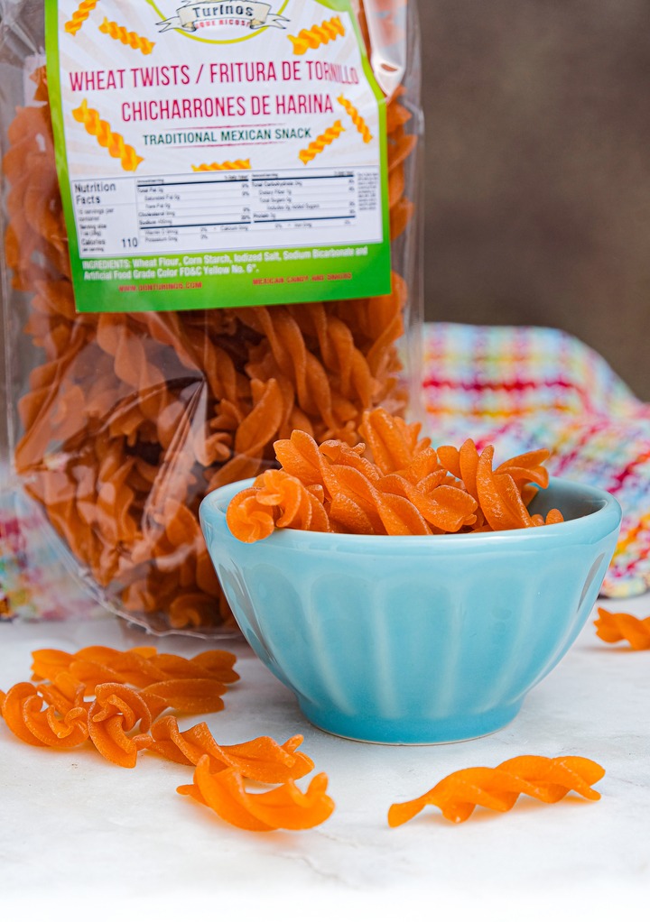 Chicarrones de harina in a teal bowl. 