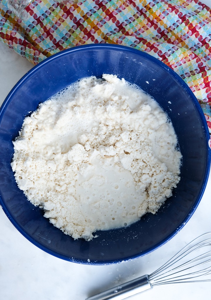 Adding water to flour mix for homemade tortillas. 