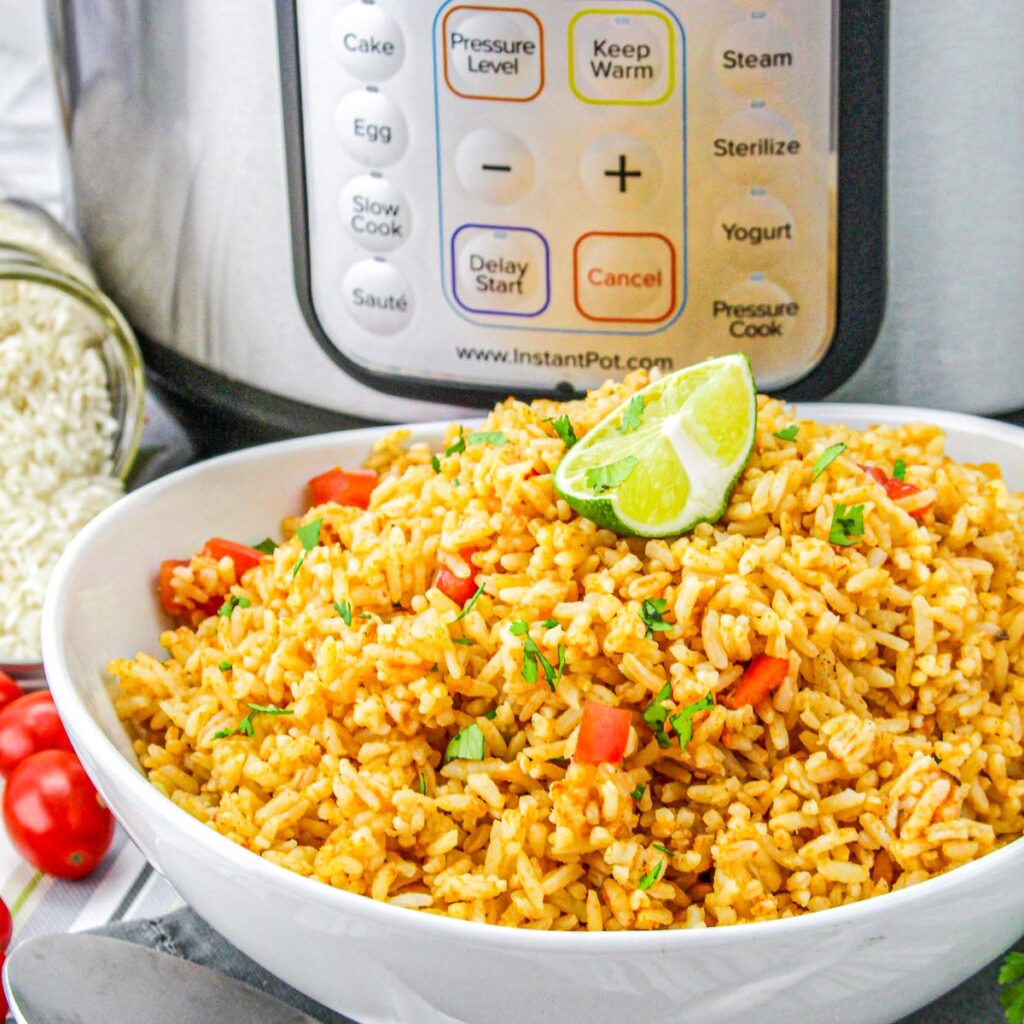 Homemade Mexican rice made in an Instant Pot in a white serving bowl.
