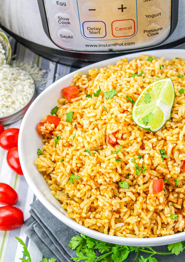 Instant Pot Mexican rice garnished with cilantro and tomatoes. 