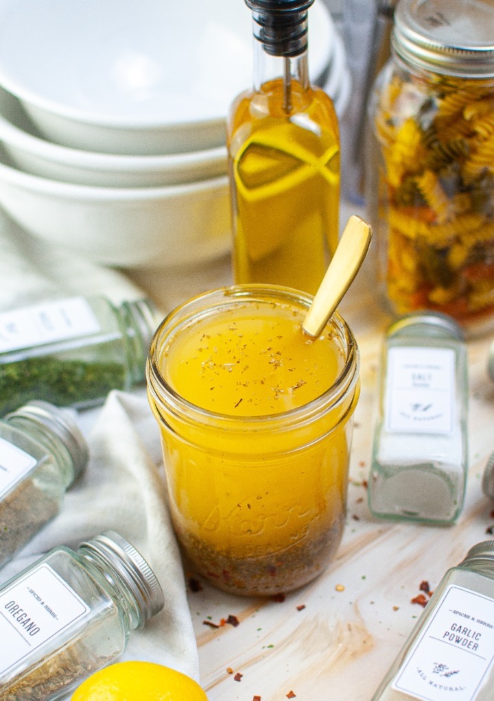 Dry spices with oil and vinegar to make a dressing in a mason jar. 