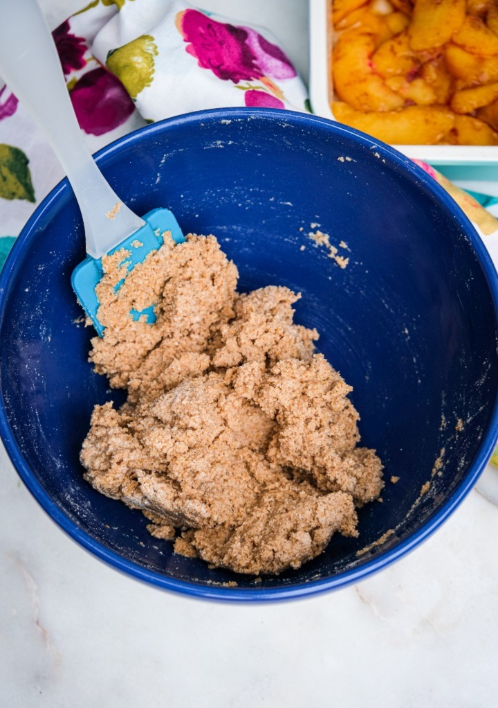 Grain free crumble mixed and ready to top on a peach crumble. 