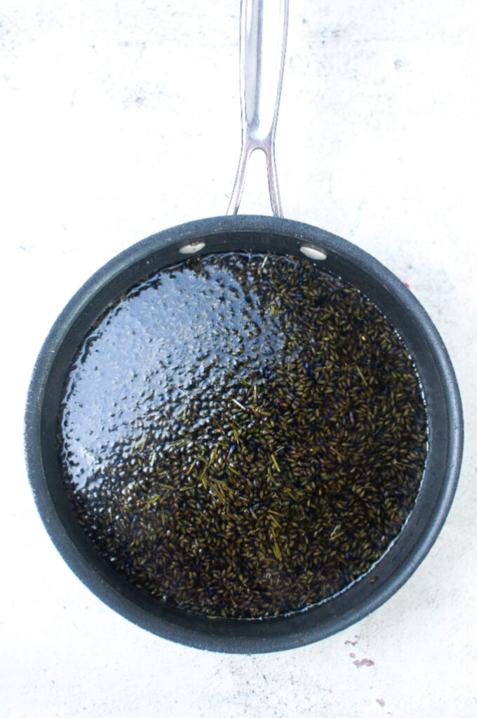 Steeping lavender buds in a sugar syrup before straining. 