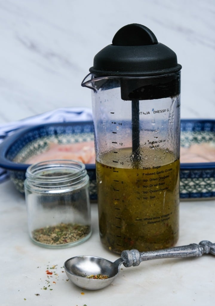 Homemade Italian dressing in a salad dressing bottle. 