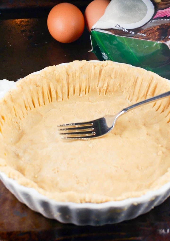 Homemade pie dough in a pie pan before baking. 