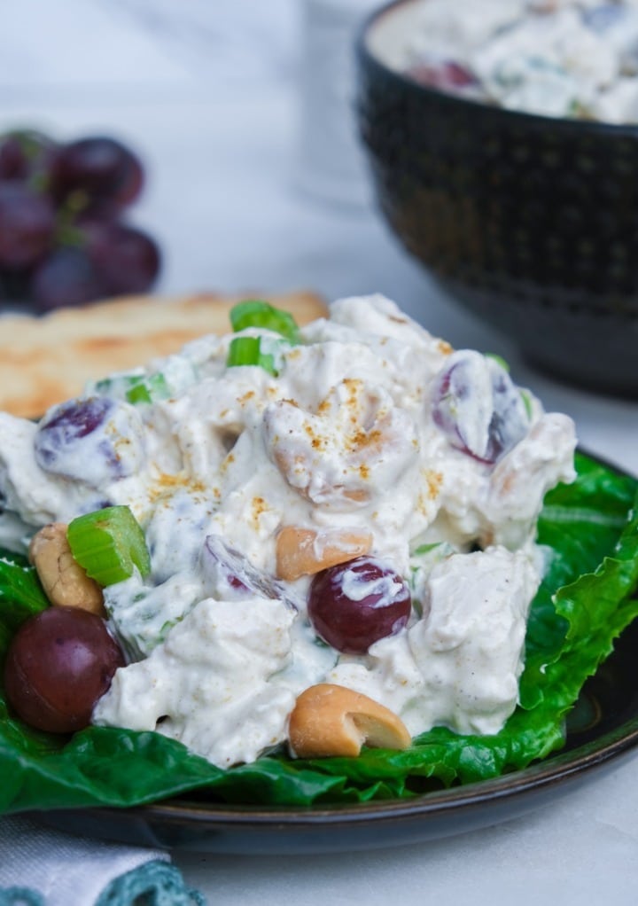 Curried chicken salad on lettuce leaves.