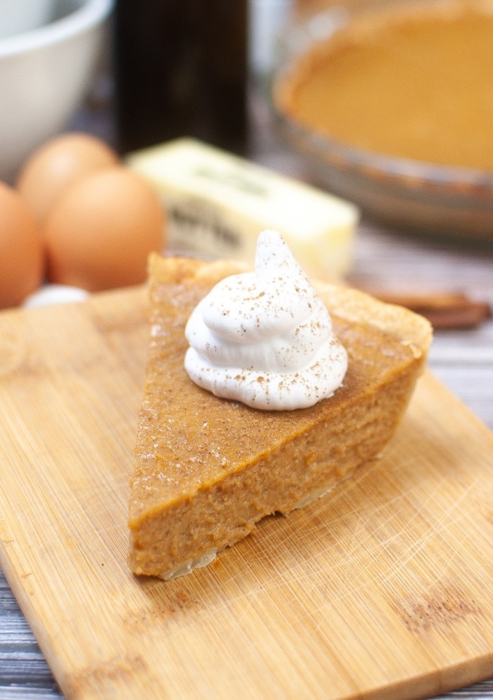 A slice of sugar free sweet potato pie on a cutting board. 