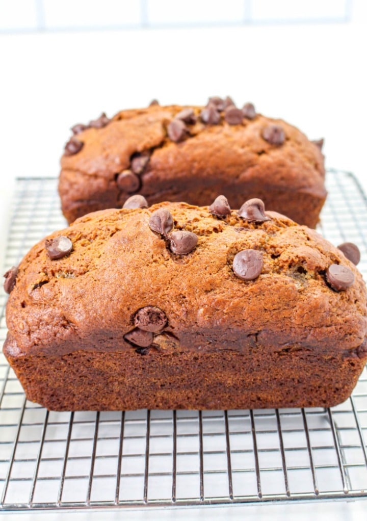 Banana bread cooling on a baking rack. 