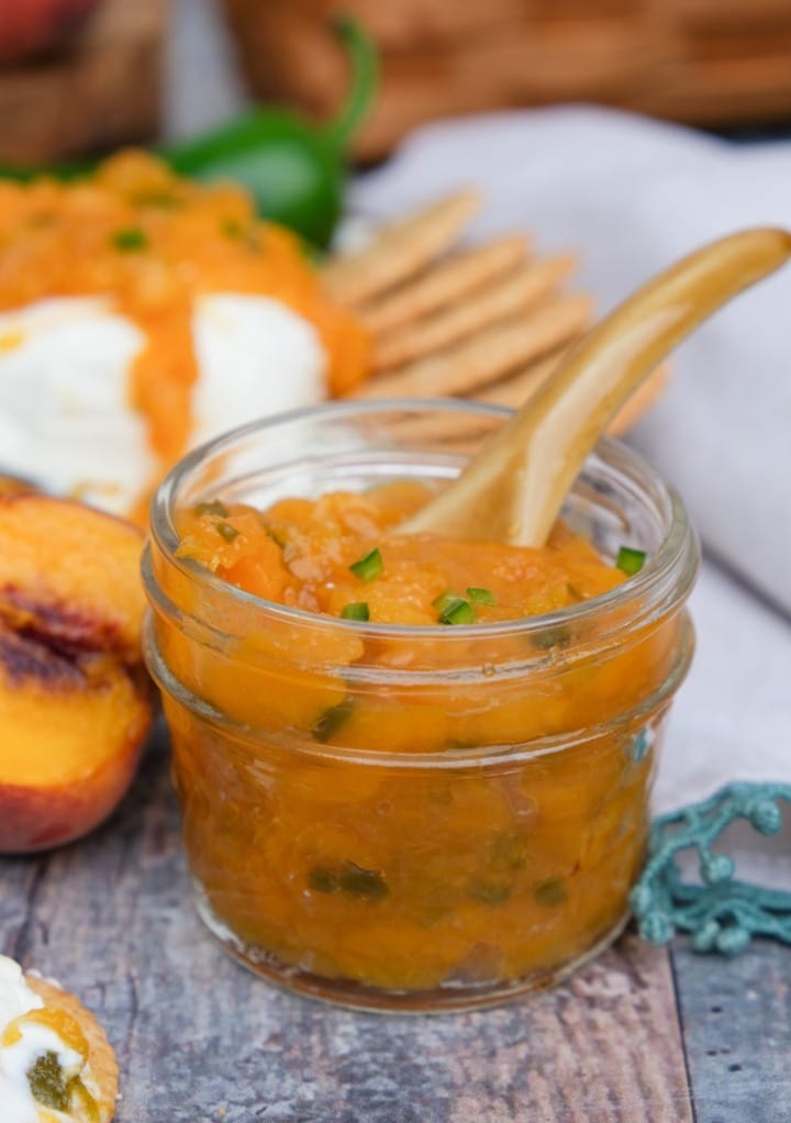 Low sugar peach jalapeno jam in a small mason jar.