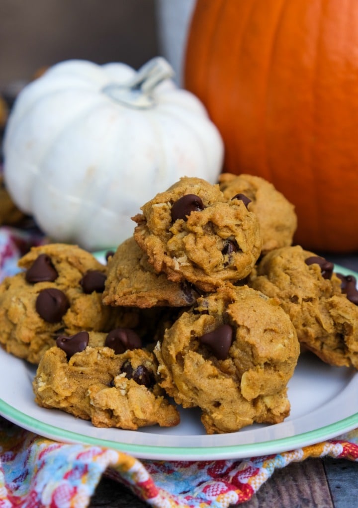 A plate full of gluten free pumpkin oatmeal cookies with chocolate chips.