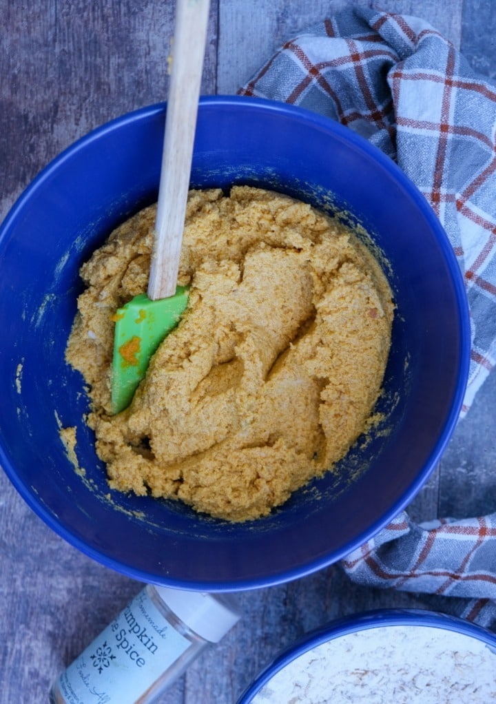 Wet ingredients in a mixing bowl for pumpkin cookie recipe. 