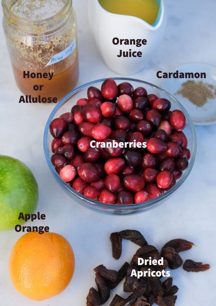 Ingredients to make cranberry chutney with apple and orange. 
