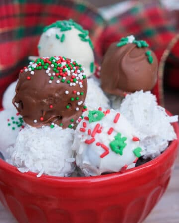 Christmas Oreo balls in a small red bowl ready to eat.