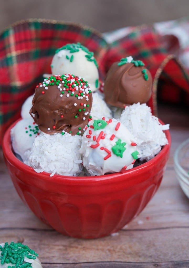 Chocolate covered Oreo balls in a red bowl.  