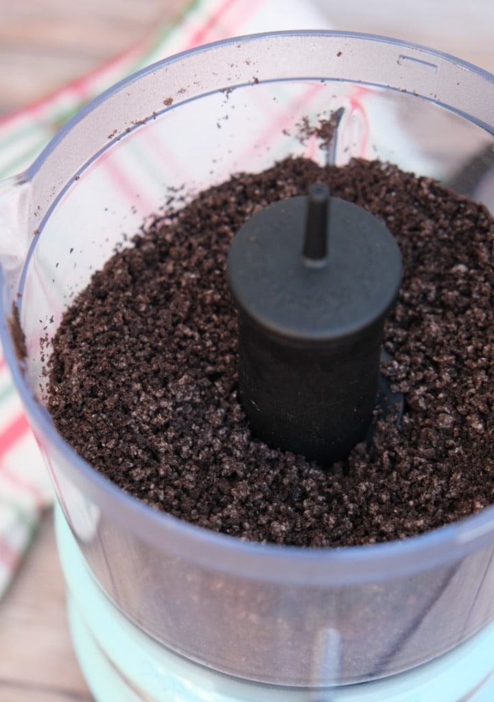 Oreo cookie crumbs in a food processor. 