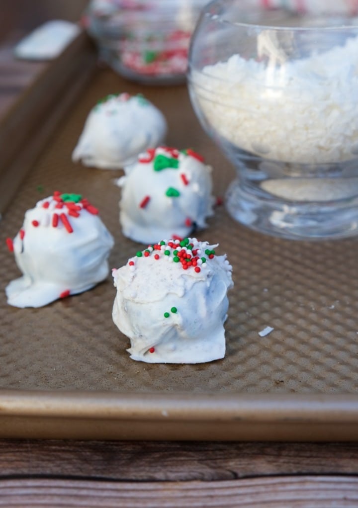 White chocolate Oreo balls with Christmas sprinkles. 