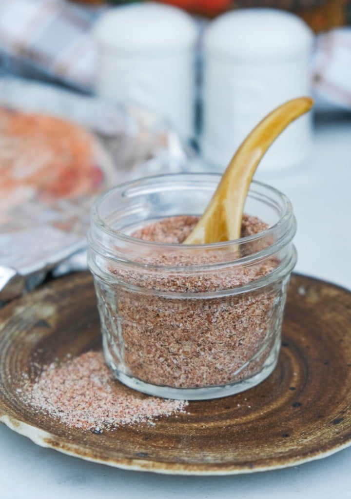 Homemade seasoning mix for chicken and turkey in a small mason jar.