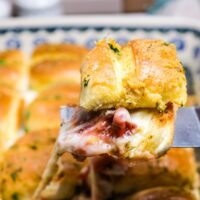 Turkey sliders with leftover turkey and cranberry sauce baked in the oven.