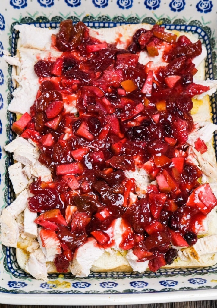 Cranberry sauce on top of diced turkey.