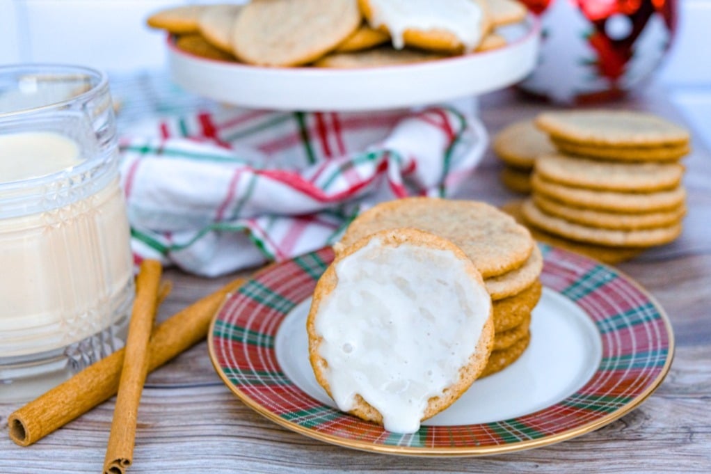 Eggnog cookies and with a glaze on a Christmas plate ready to eat.