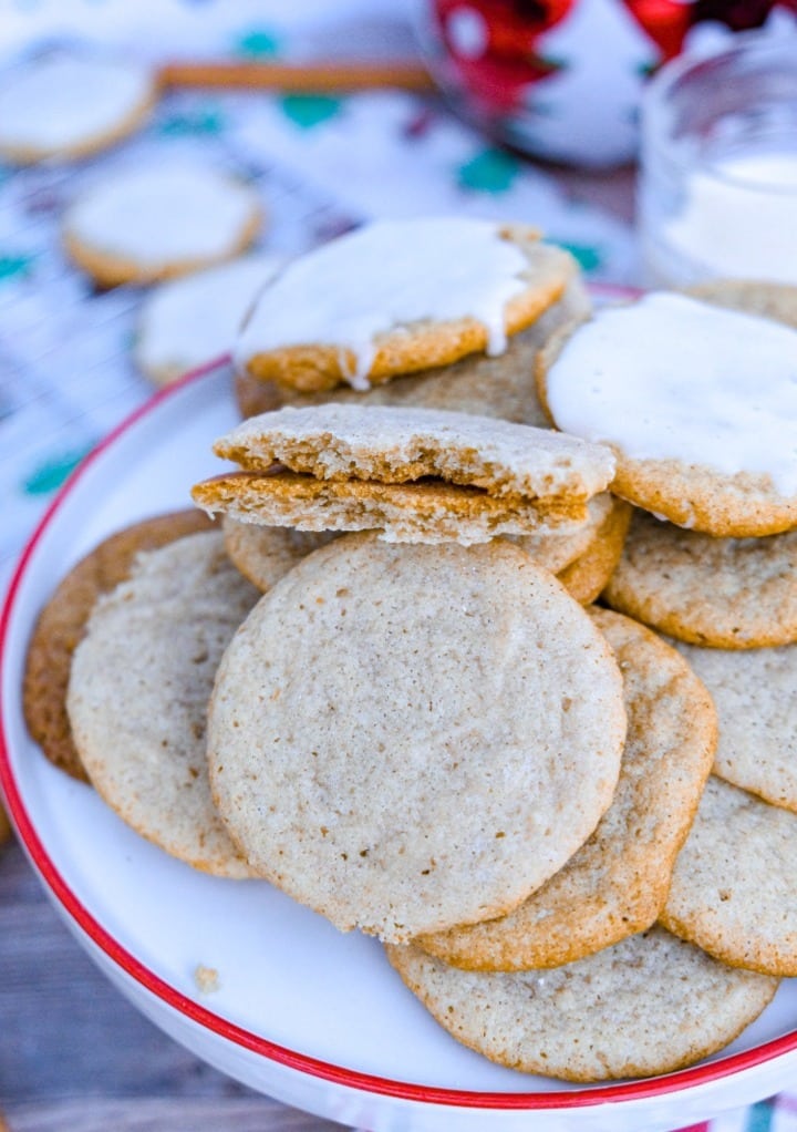 Air fryer eggnog cookies on a white platter with a red rim.