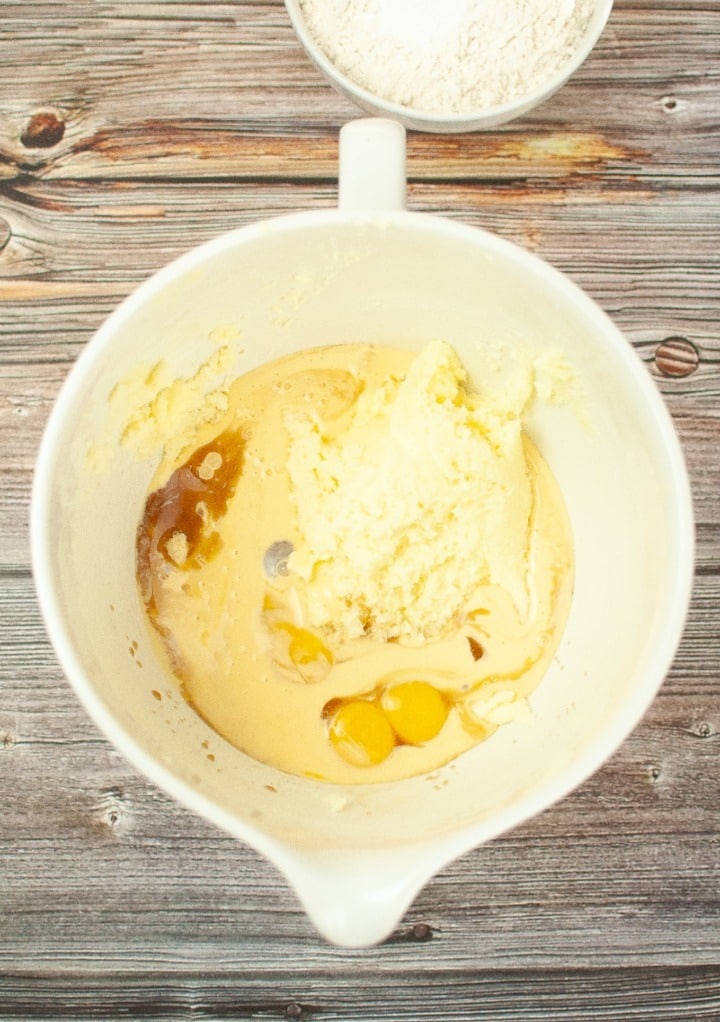 Butter mix with eggs and vanilla in a mixing bowl. 
