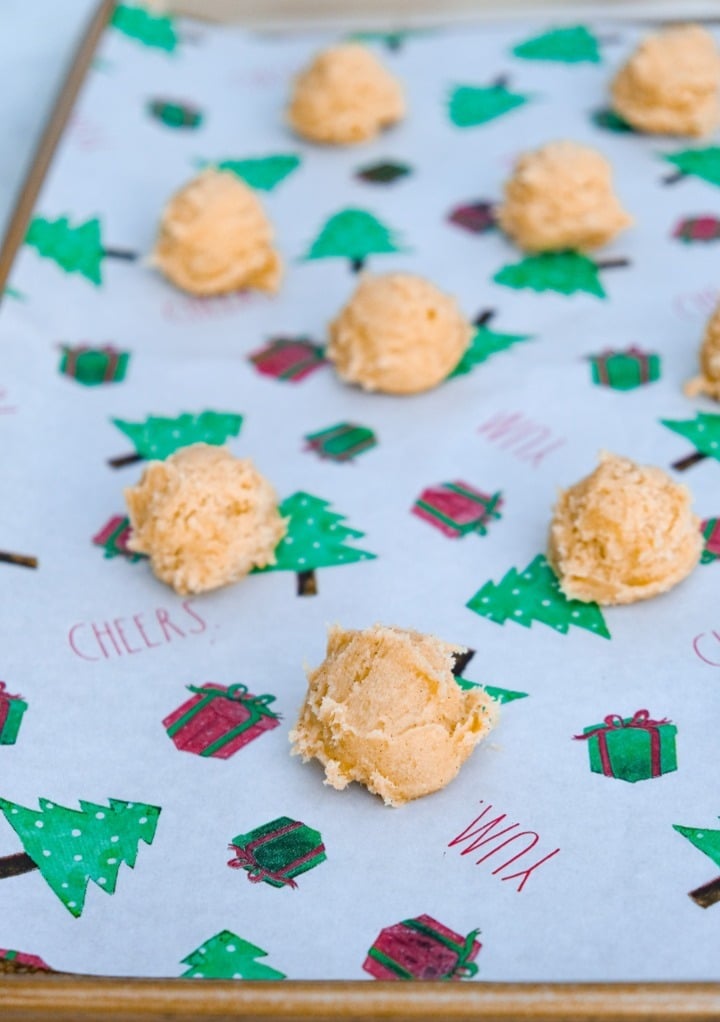 Cookie dough on parchment lined cookie sheet before baking.