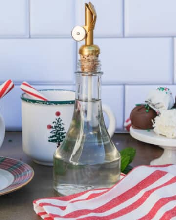 Peppermint syrup in a glass jar ready to pour in glasses.