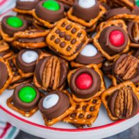 Rolo pretzel bites with m&m and pecan halves.