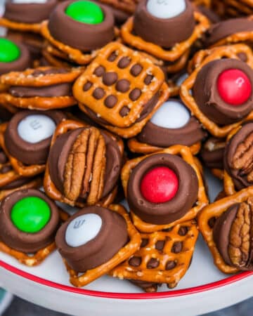 Rolo pretzel bites with m&m and pecan halves.