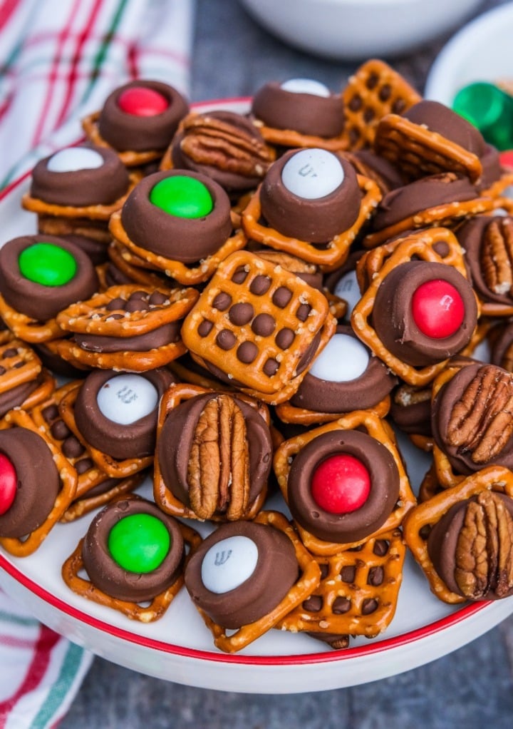 no bake pretzels with rolo caramel candy on a white platter. 