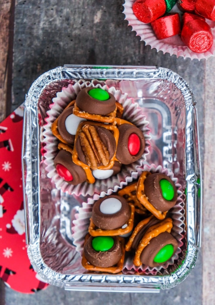 Top view of rolo candy with pretzels packaged in a small aluminum tin. 