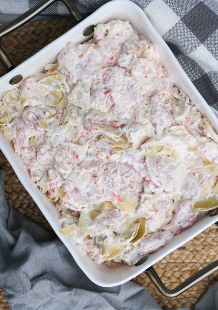 Top view of chicken casserole in a white baking dish. 