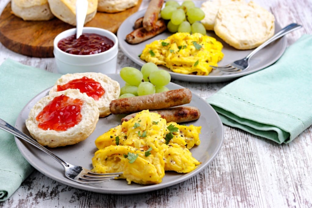 Brunch meal on a light blue plate ready to enjoy. 