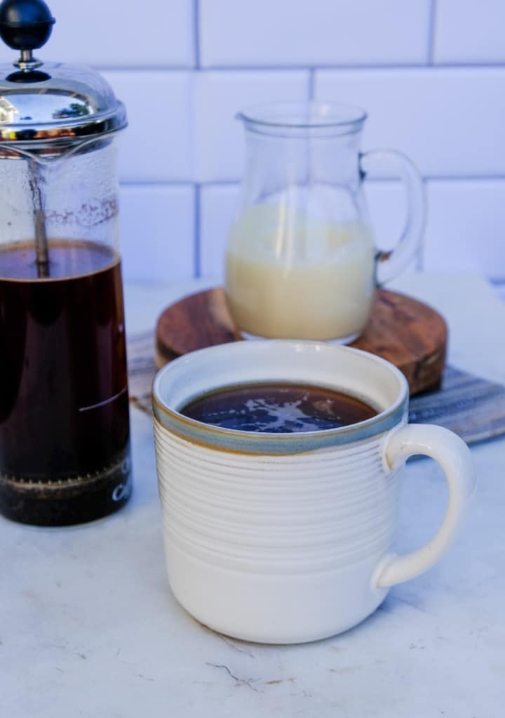 Mug filled with coffee.