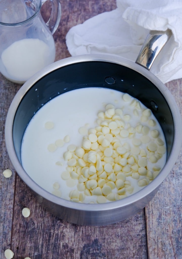 Chocolate chips and milk in a saucepan before melting. 