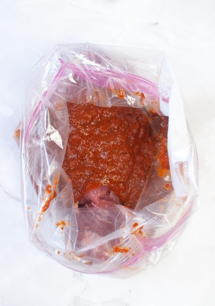 Chipotle sauce in a ziplock bag with the pork marinating.  