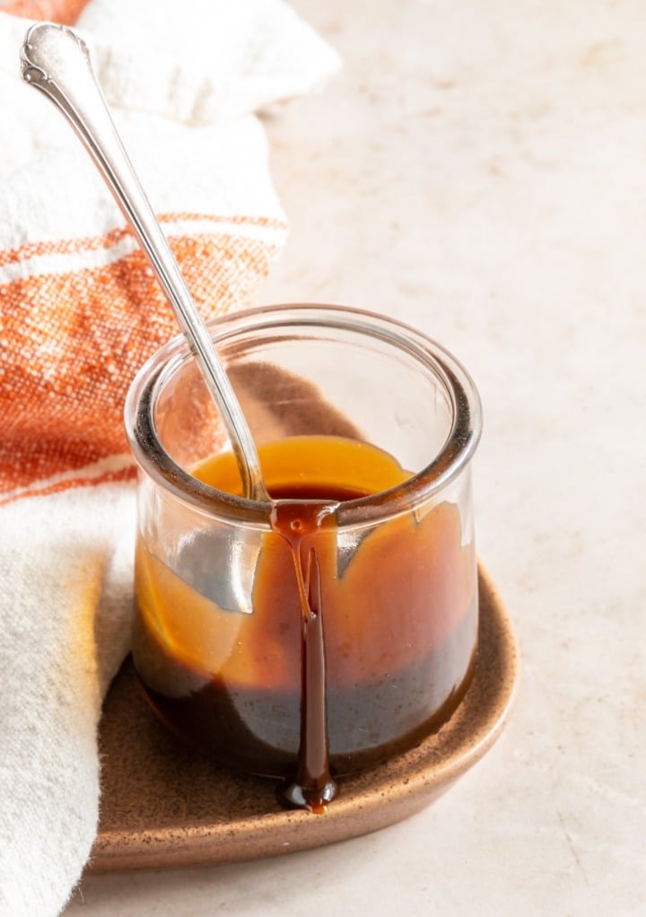 Caramel sauce in a small jar ready to enjoy.