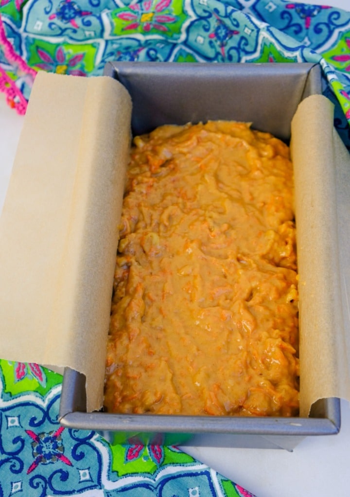 Carrot cake batter in a loaf pan before baking.